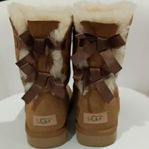 UGG Women's Tan Shearling Boots NWOT with Bow Accents